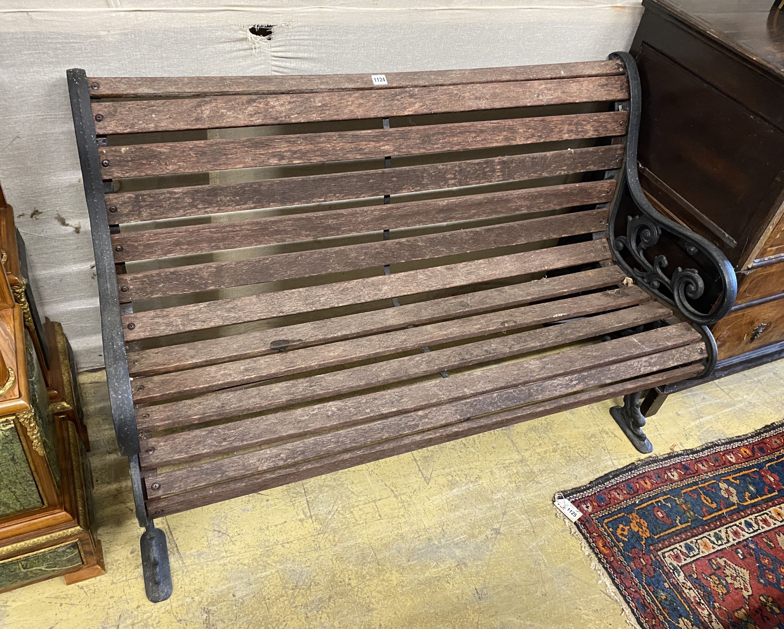 A Victorian style cast metal slatted wood garden bench, length 128cm, depth 56cm, height 77cm